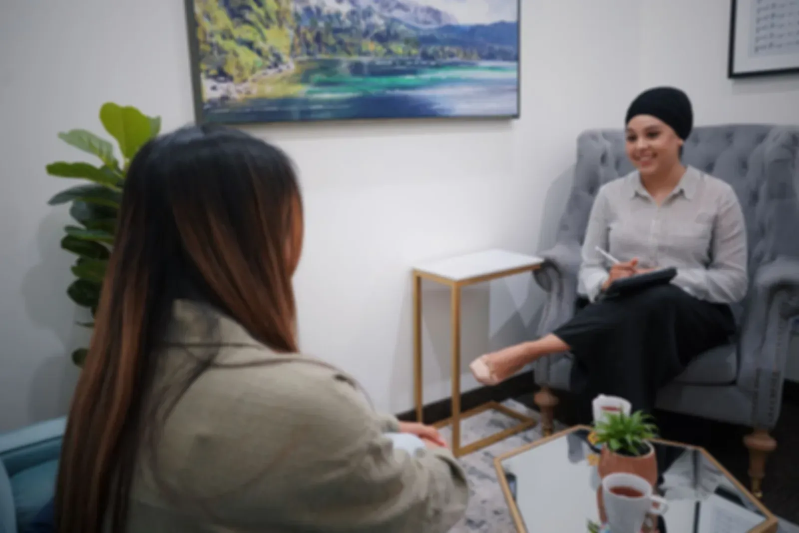 Two advisers in conversation in a bright office