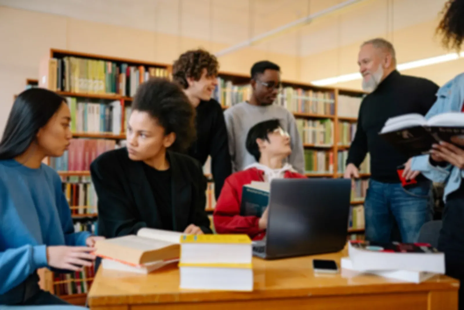 A group of students working together in a university library
